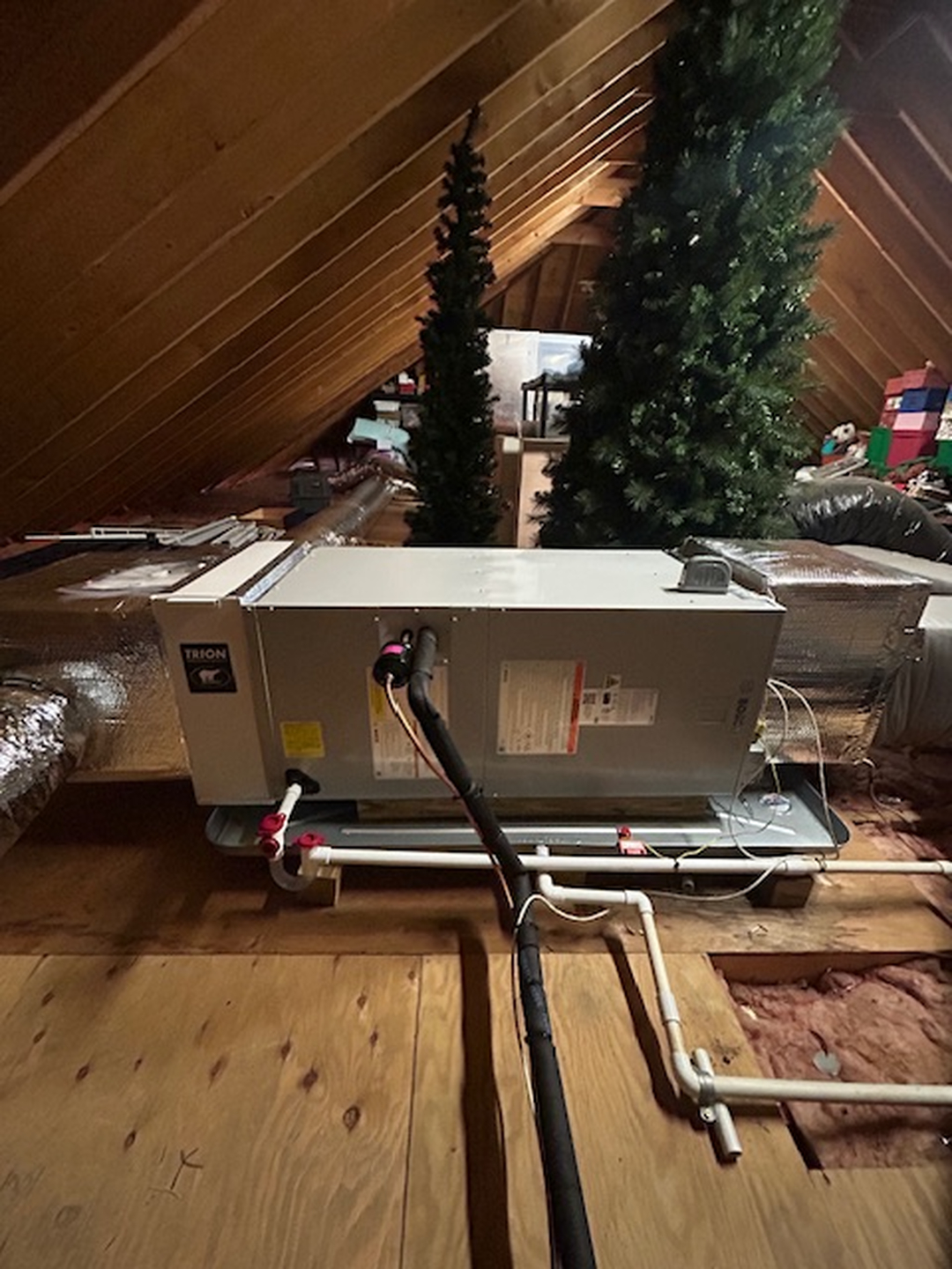 Attic ductwork installation by Fong & Sullivan technician