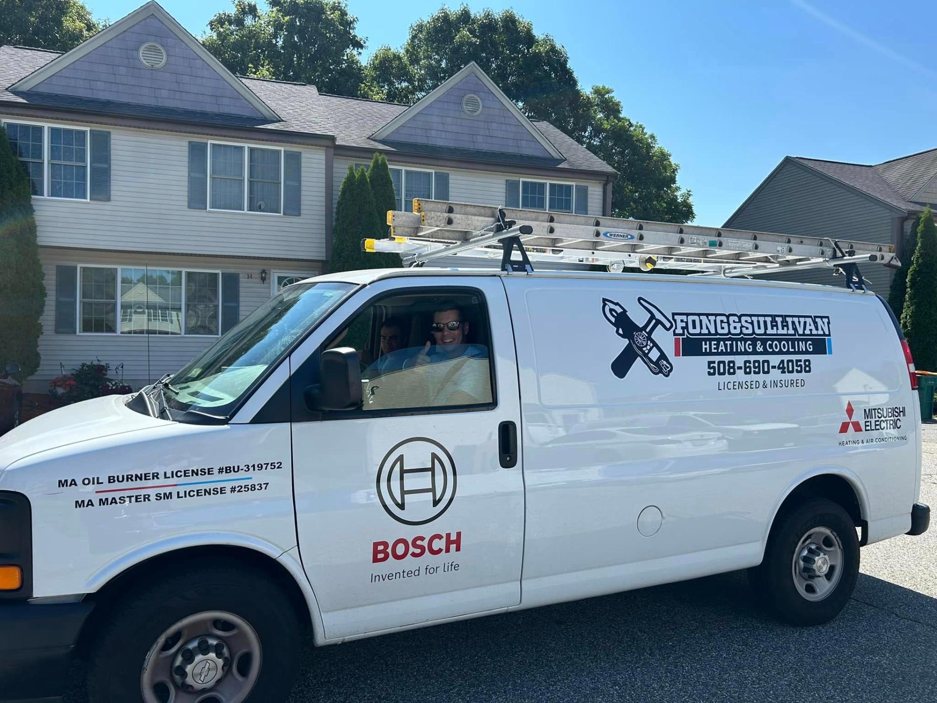 Fong & Sullivan owner giving thumbs up from service truck