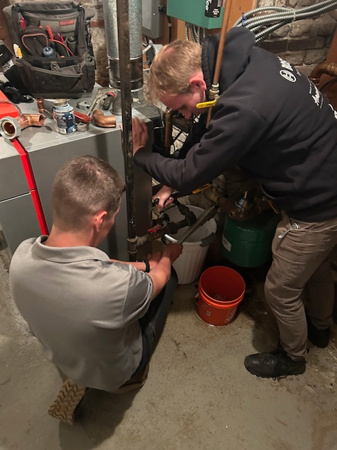Fong & Sullivan technicians servicing a heating system